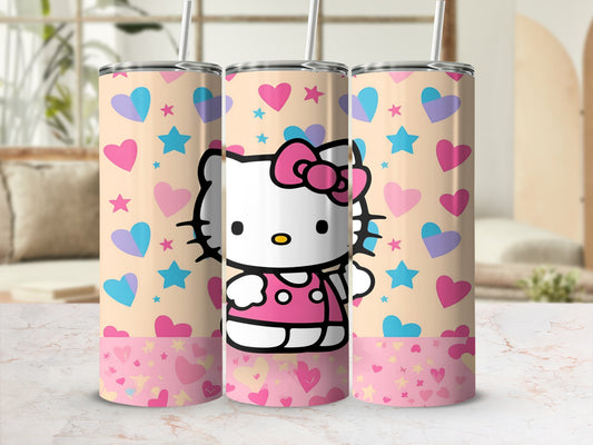 Hello Kitty tumbler with pink and blue hearts and stars on beige background.