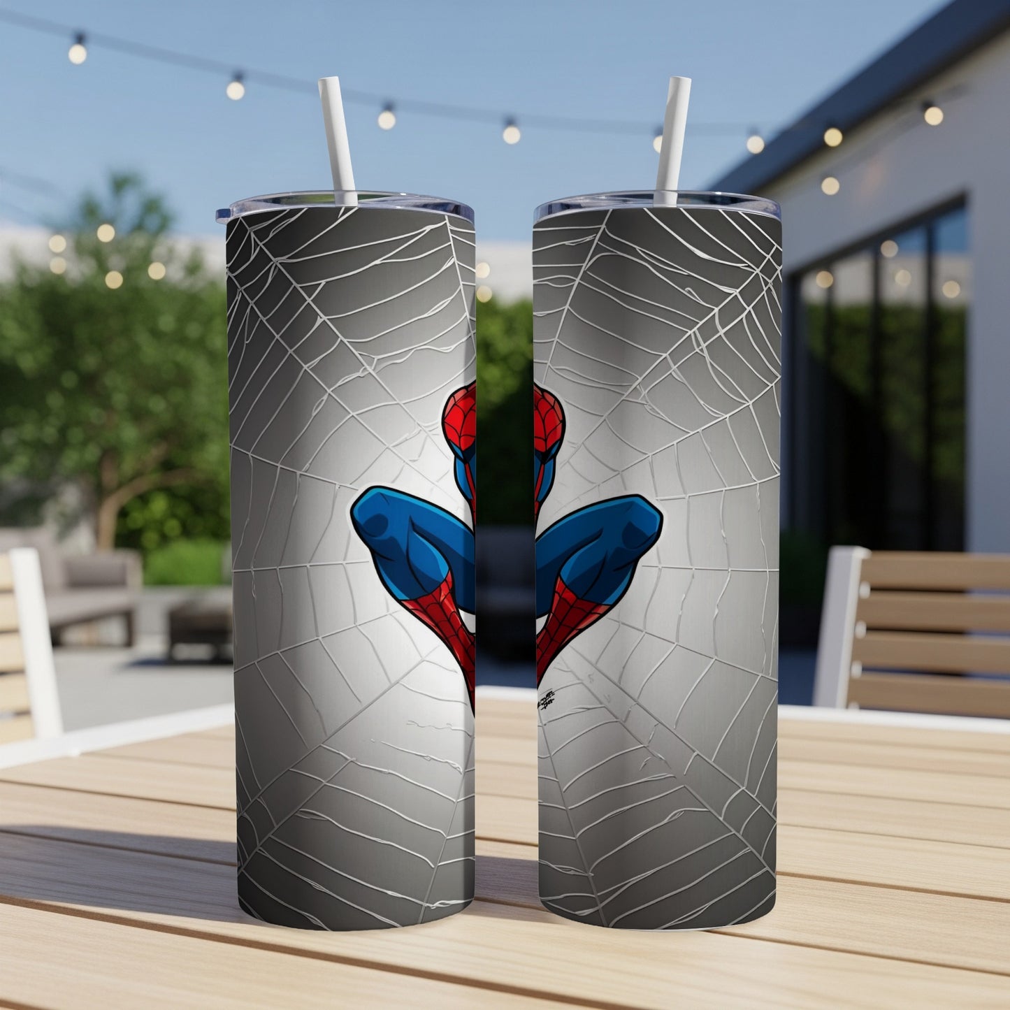 Spider-Man on a web background, two metal tumblers with straws.