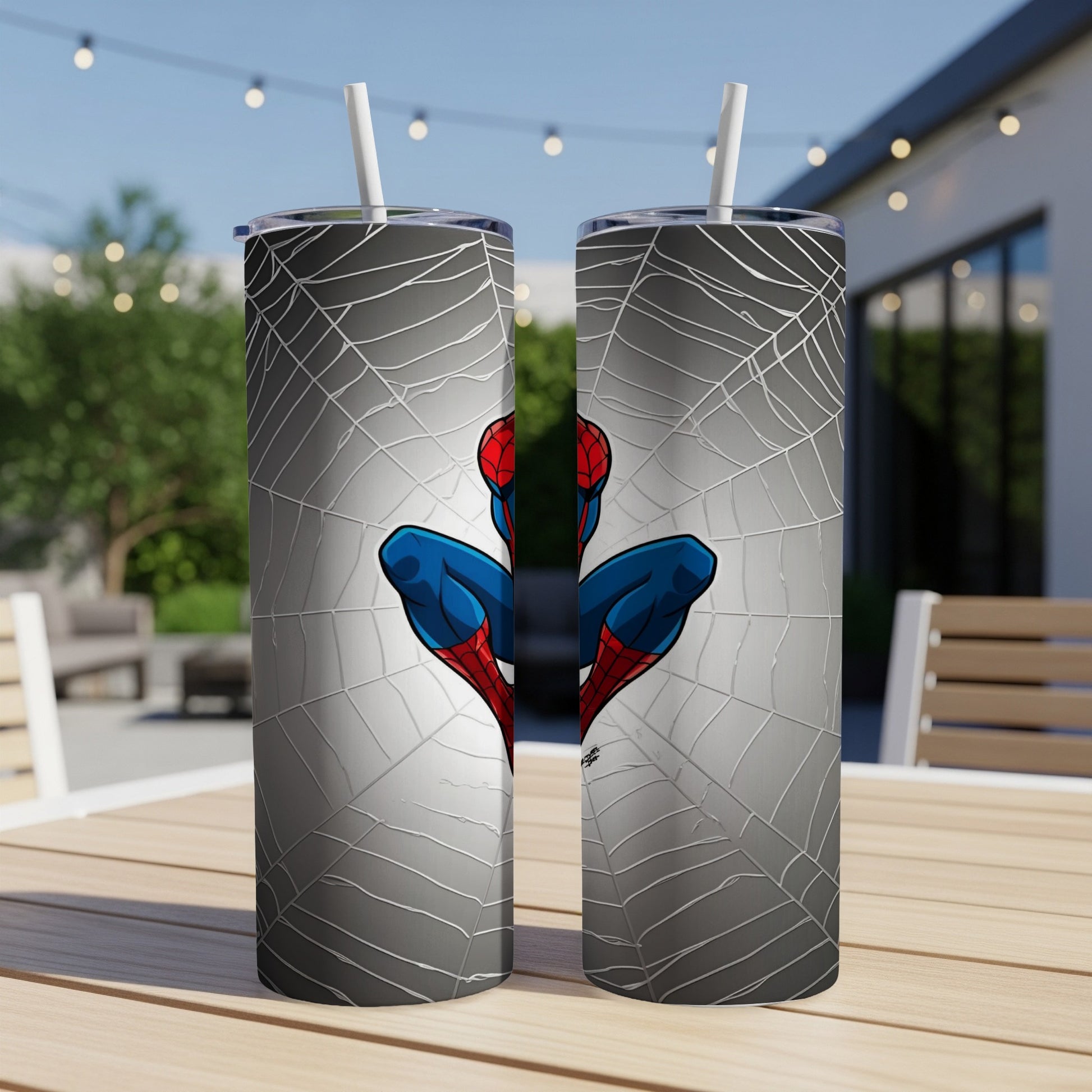 Spider-Man on a web background, two metal tumblers with straws.