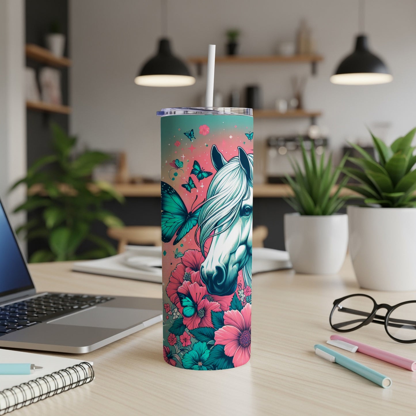 White horse head with teal butterflies and pink flowers on a tumbler.