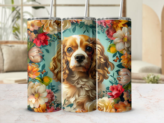 Cavalier King Charles Spaniel surrounded by colorful flowers on a tumbler.