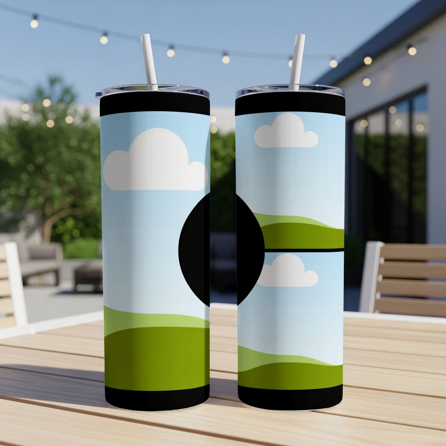 Two tall tumblers with cartoon sky and landscape design and straws.