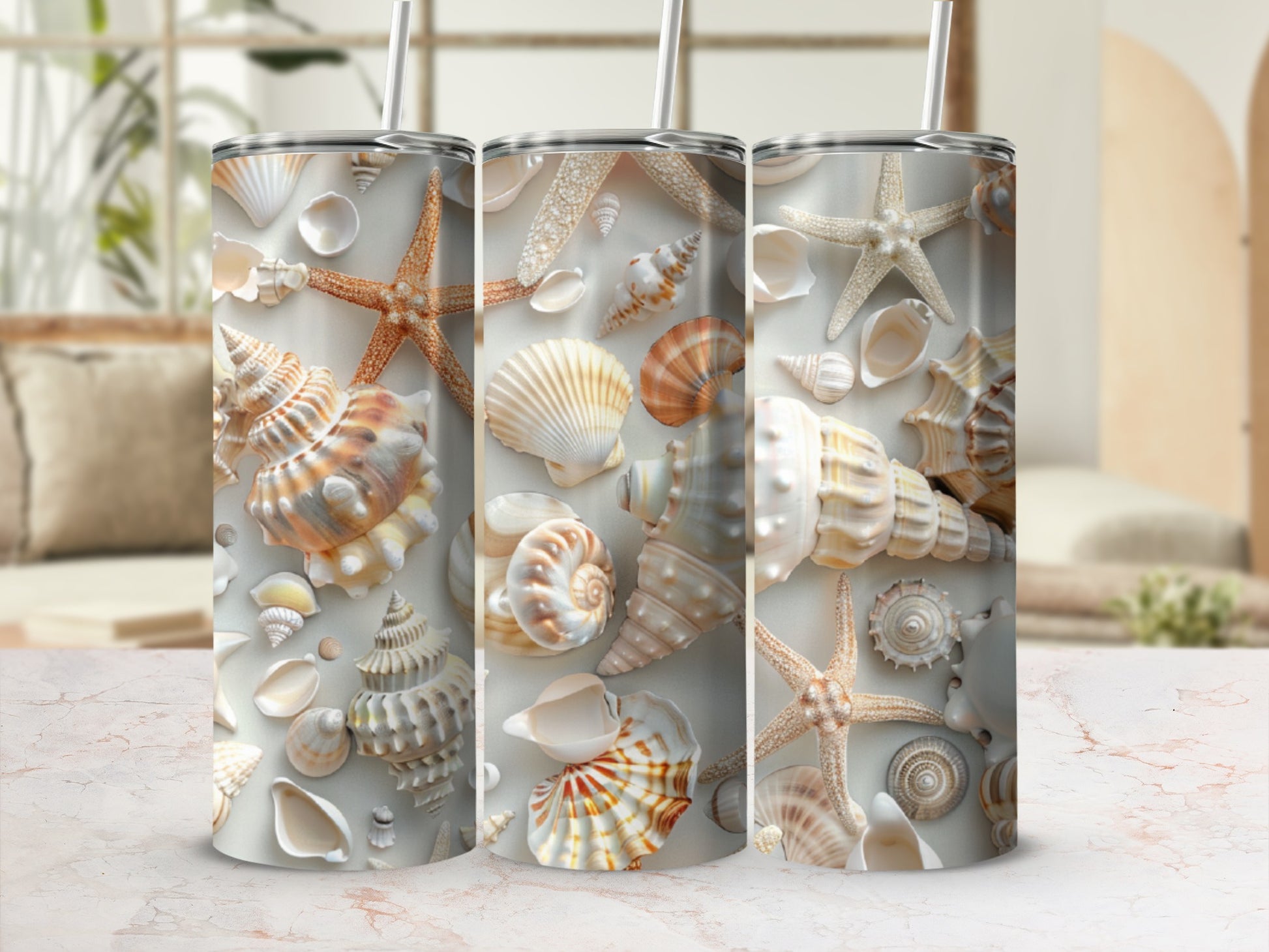 Three tumblers with seashell and starfish pattern.