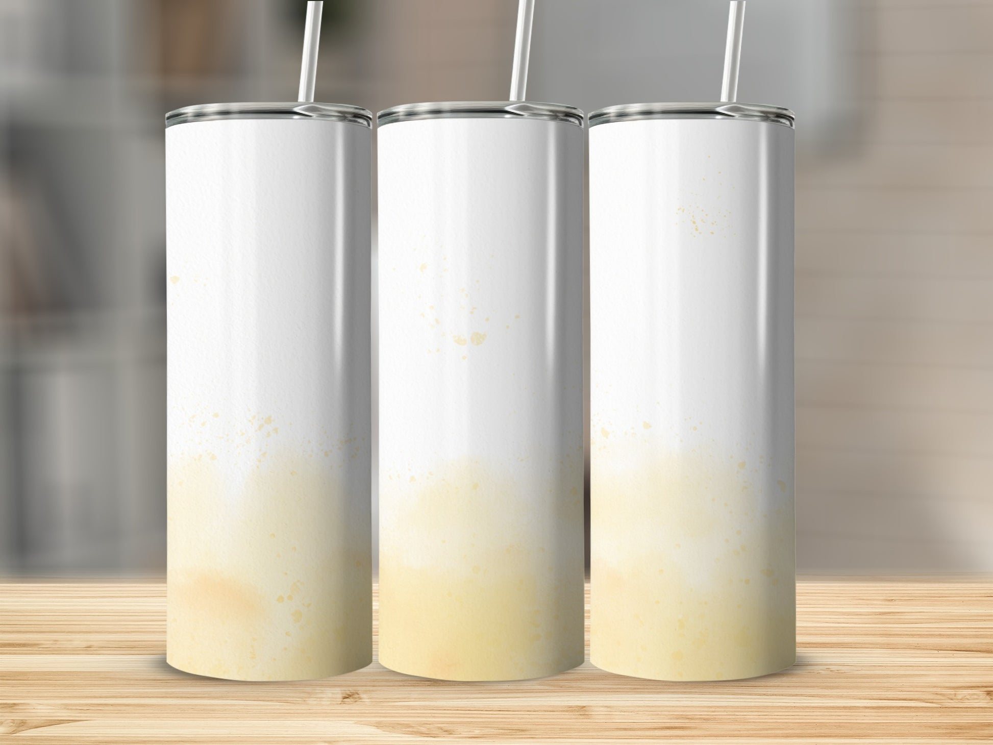Three blank white tumblers with yellow speckled watercolor wash effect.