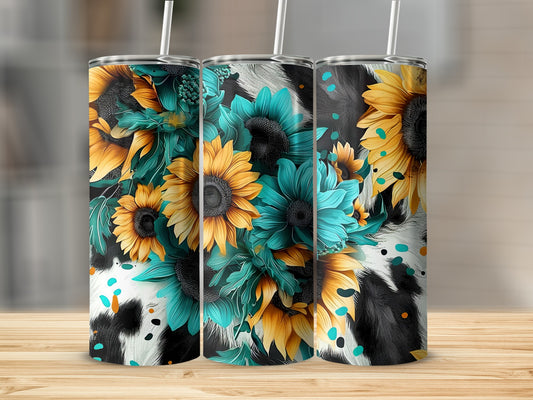 Sunflower and cow print tumbler design with straws on a wooden surface.