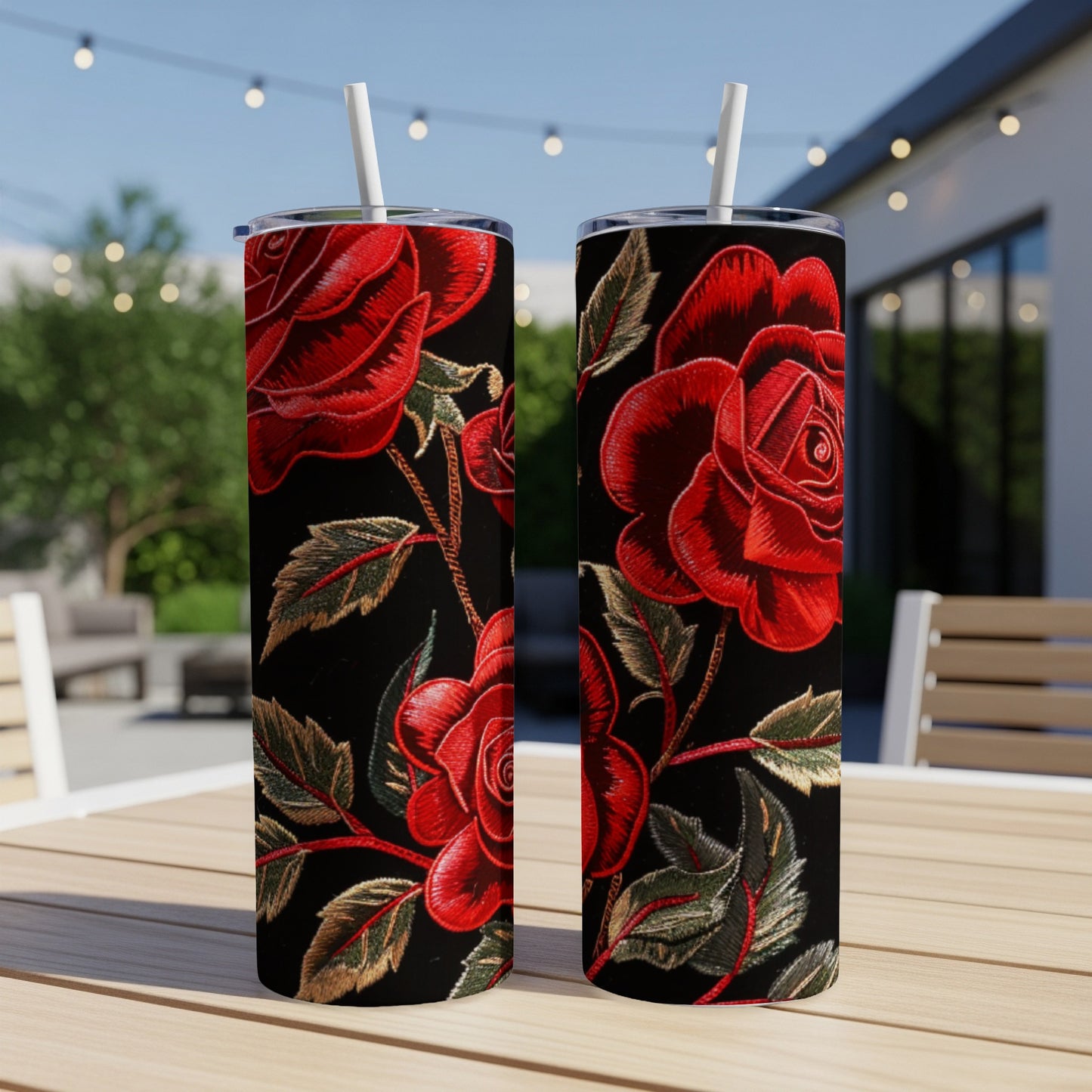 Two tumblers with a red rose embroidery pattern on a dark background.