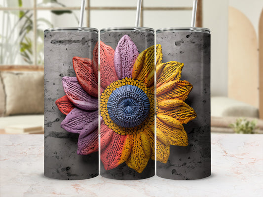 Sunflower tumbler with textured concrete background.
