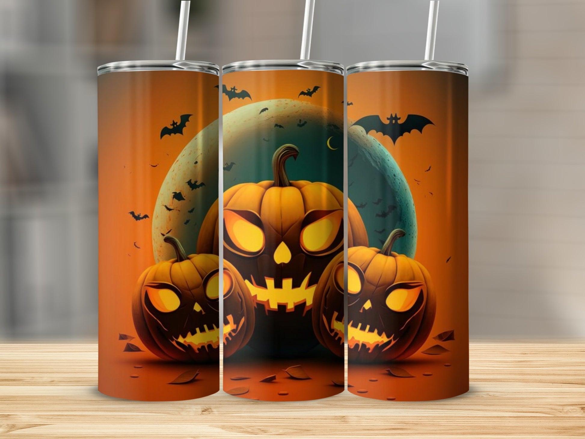 Three tumblers feature a Halloween design with carved pumpkins, bats, and a large moon.