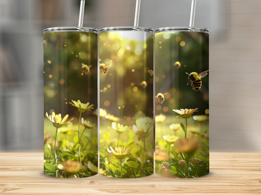 Three tumblers with bees and daisies on a wooden surface.