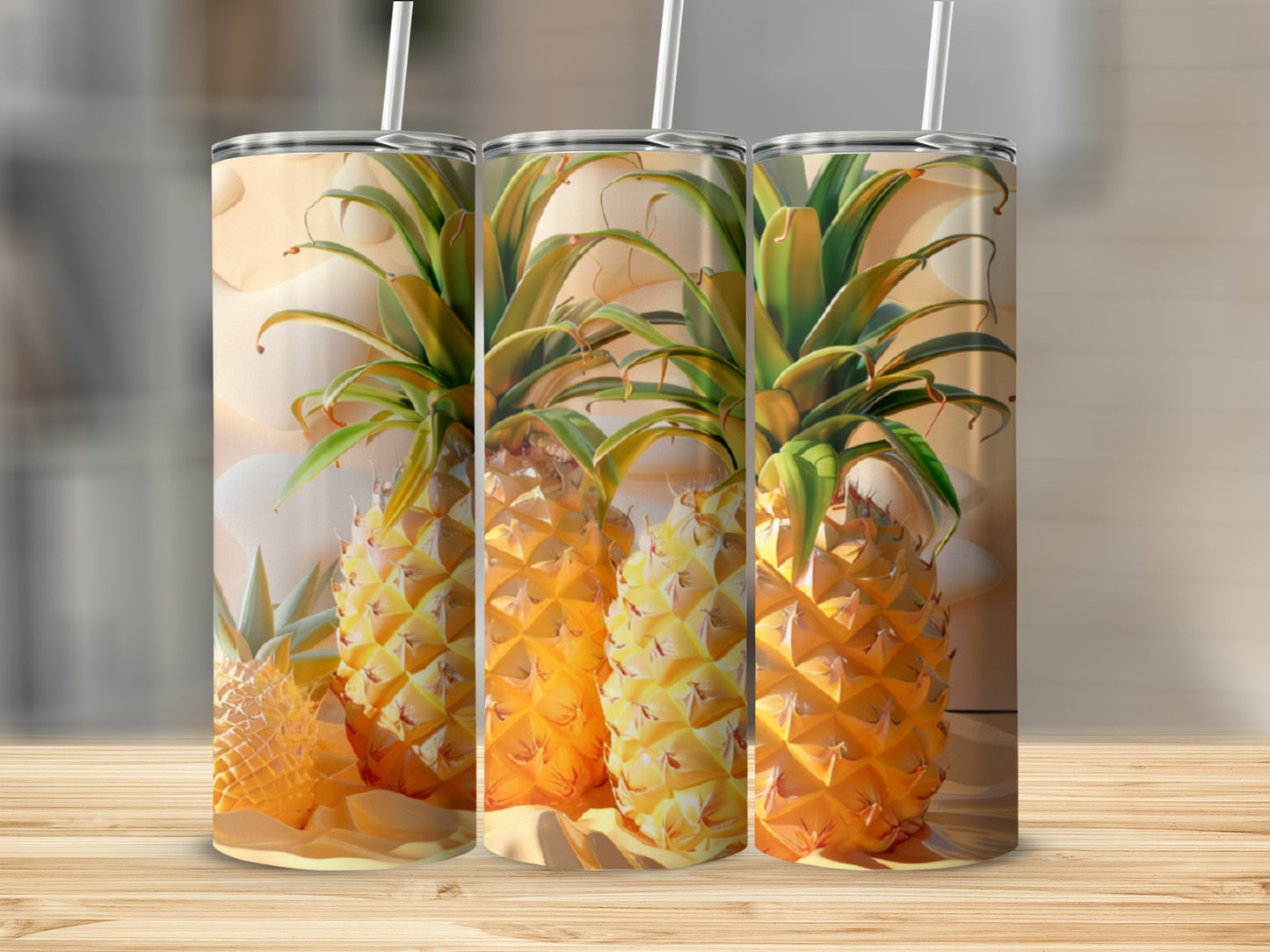 Three tumblers with pineapple designs stand on a wooden surface.