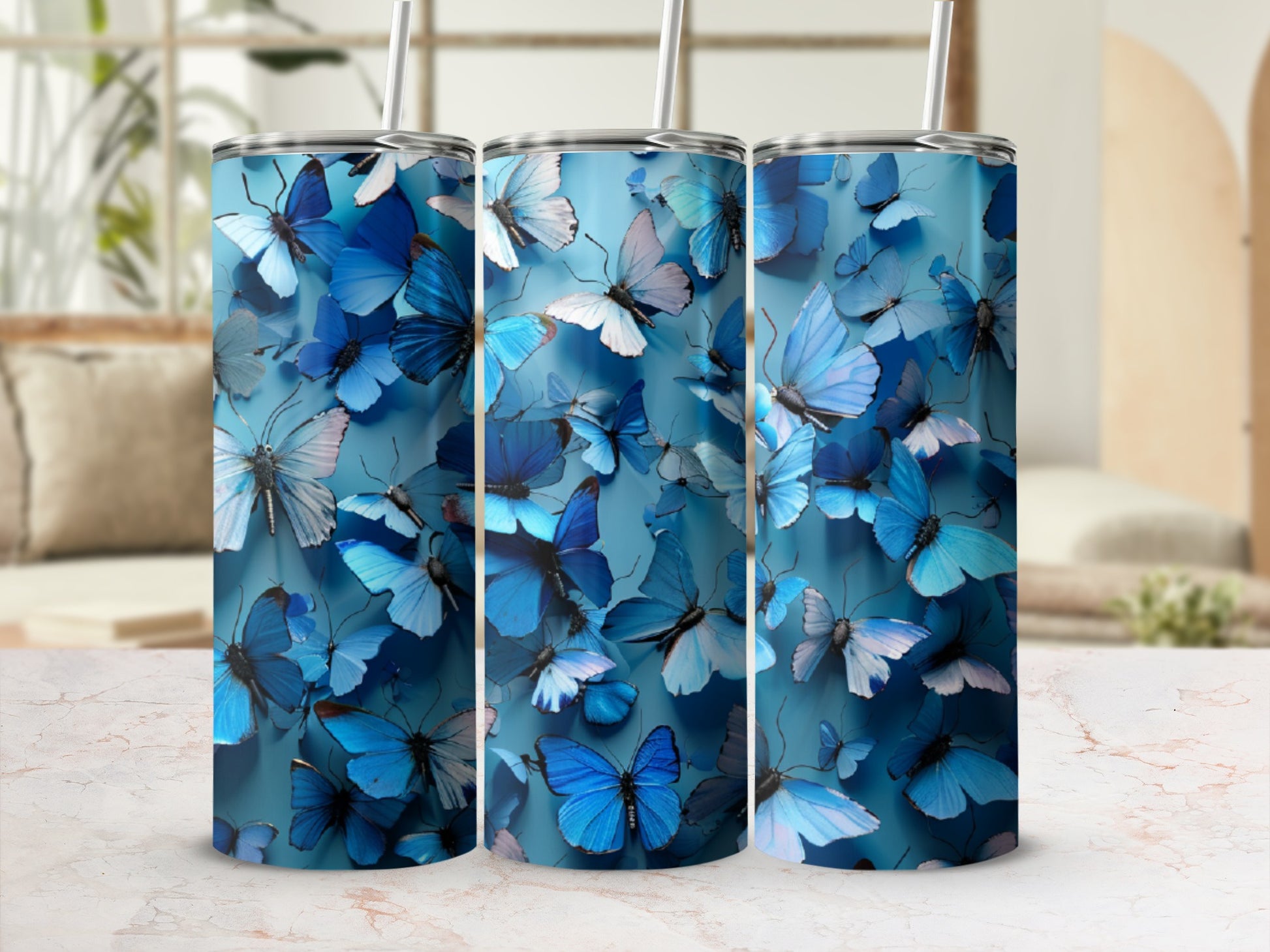 Blue butterflies adorn a light blue textured tumbler with a straw.
