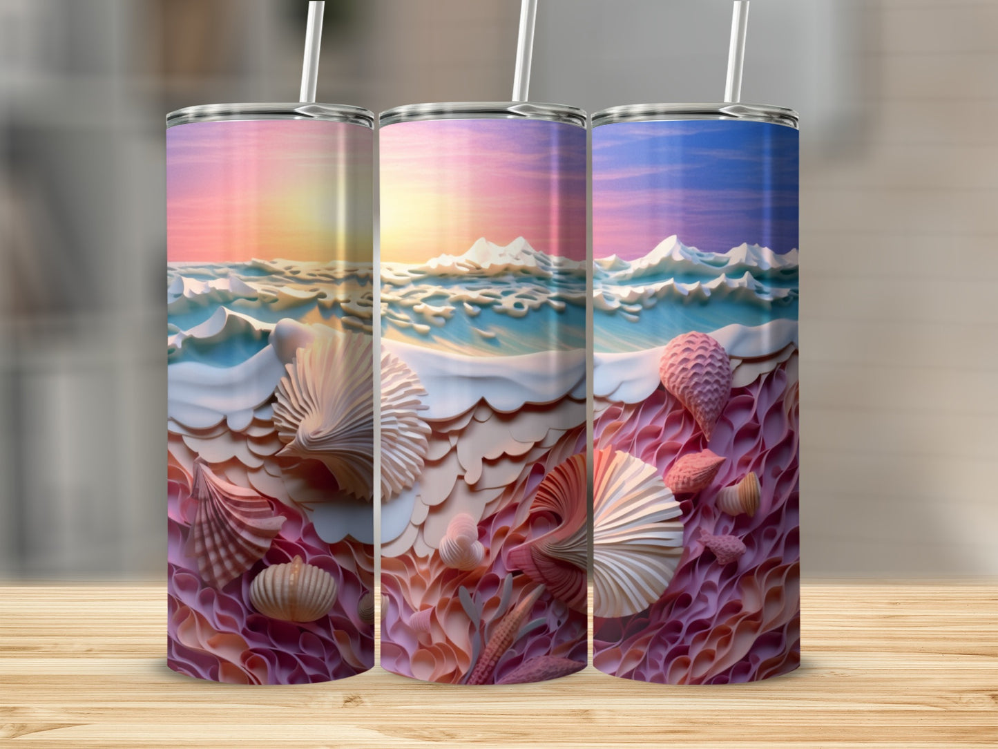 Three tumblers with a sunset ocean scene and seashells.