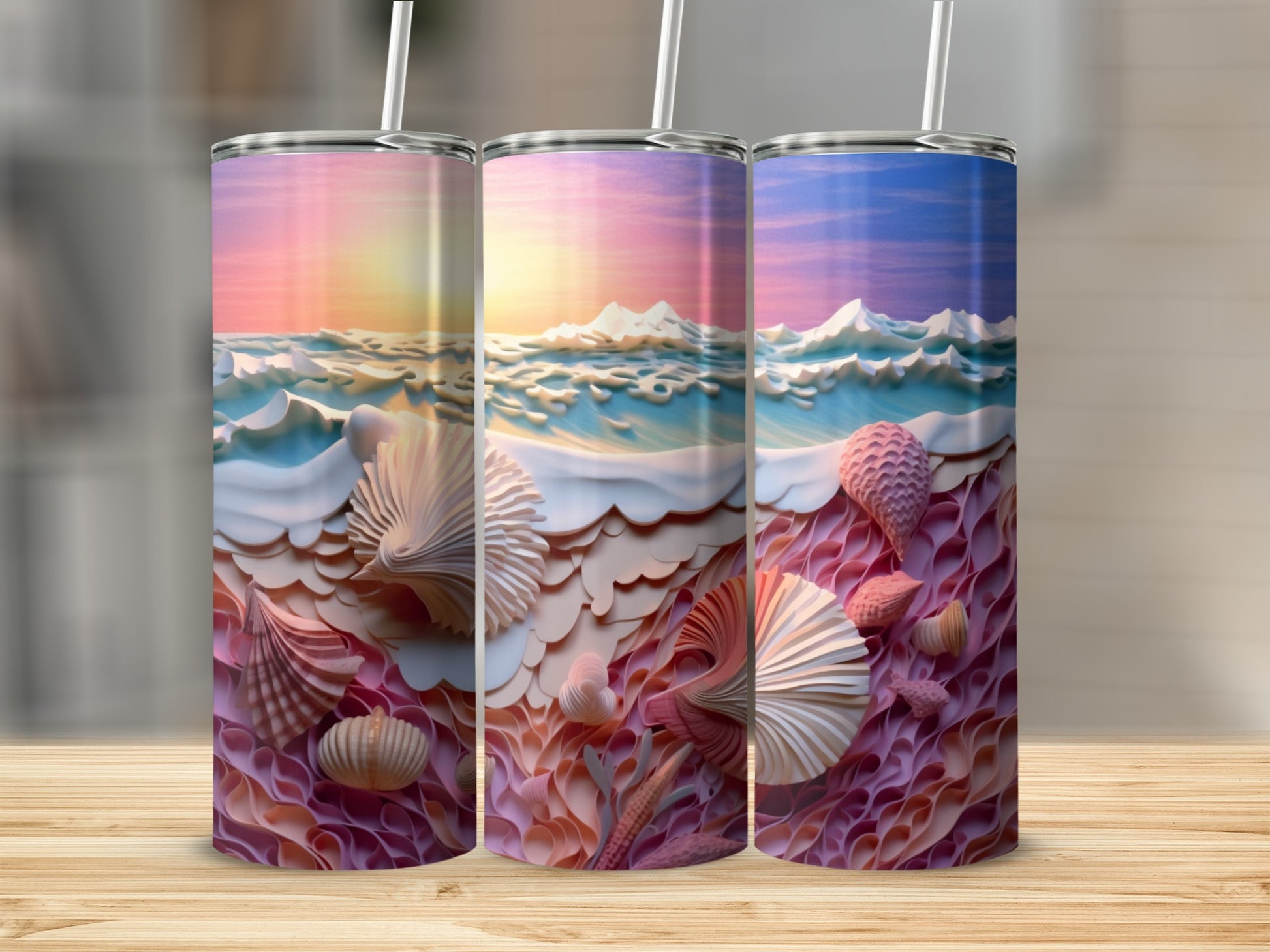 Three tumblers with a sunset ocean scene and seashells.