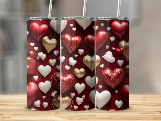 Three tumblers decorated with a pattern of red and gold hearts and beads.