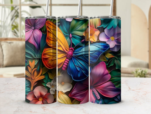 Three tumblers with colorful butterflies and floral designs.