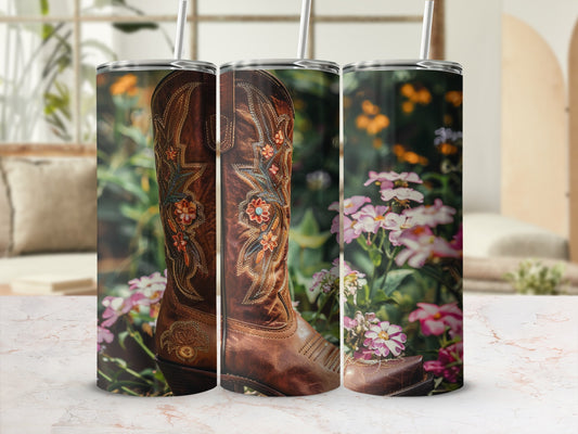 Brown leather cowboy boot with floral embroidery and straw background.