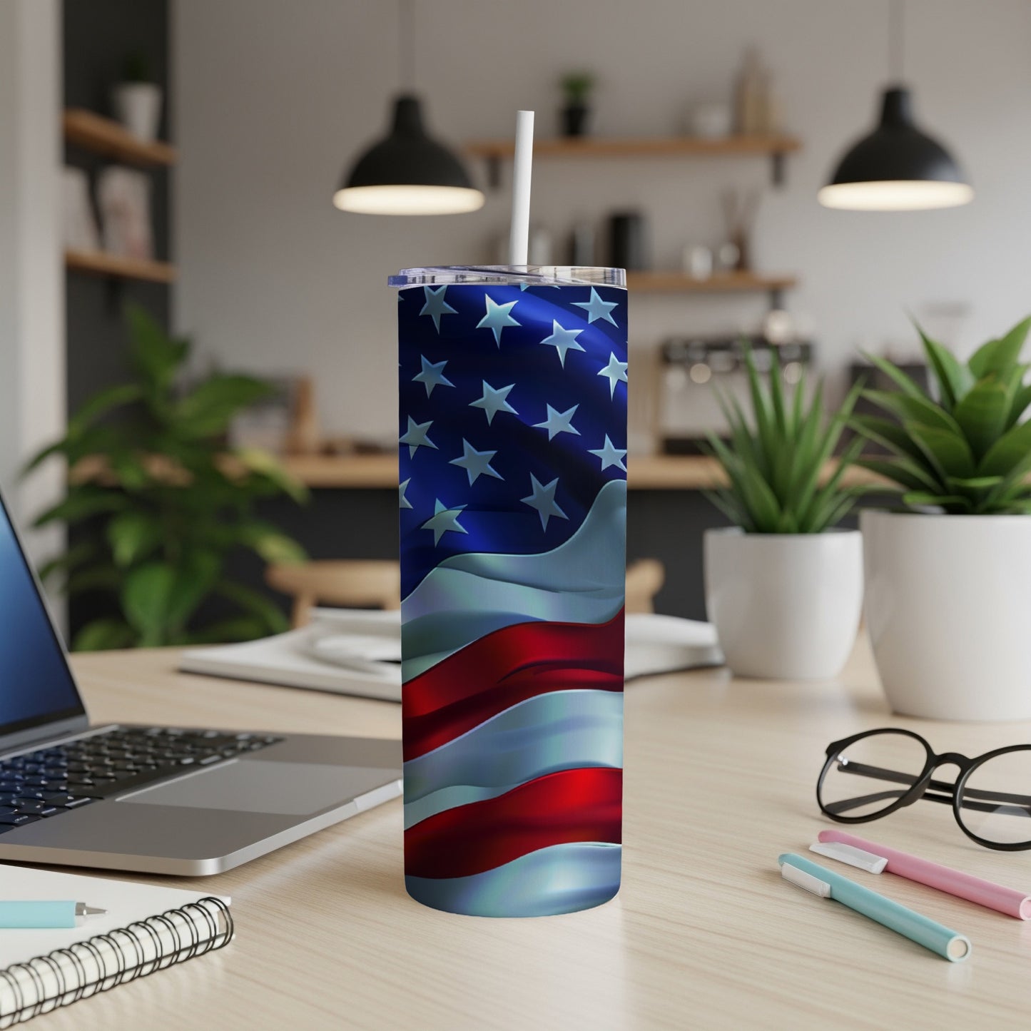 Stainless steel tumbler with waving American flag design.