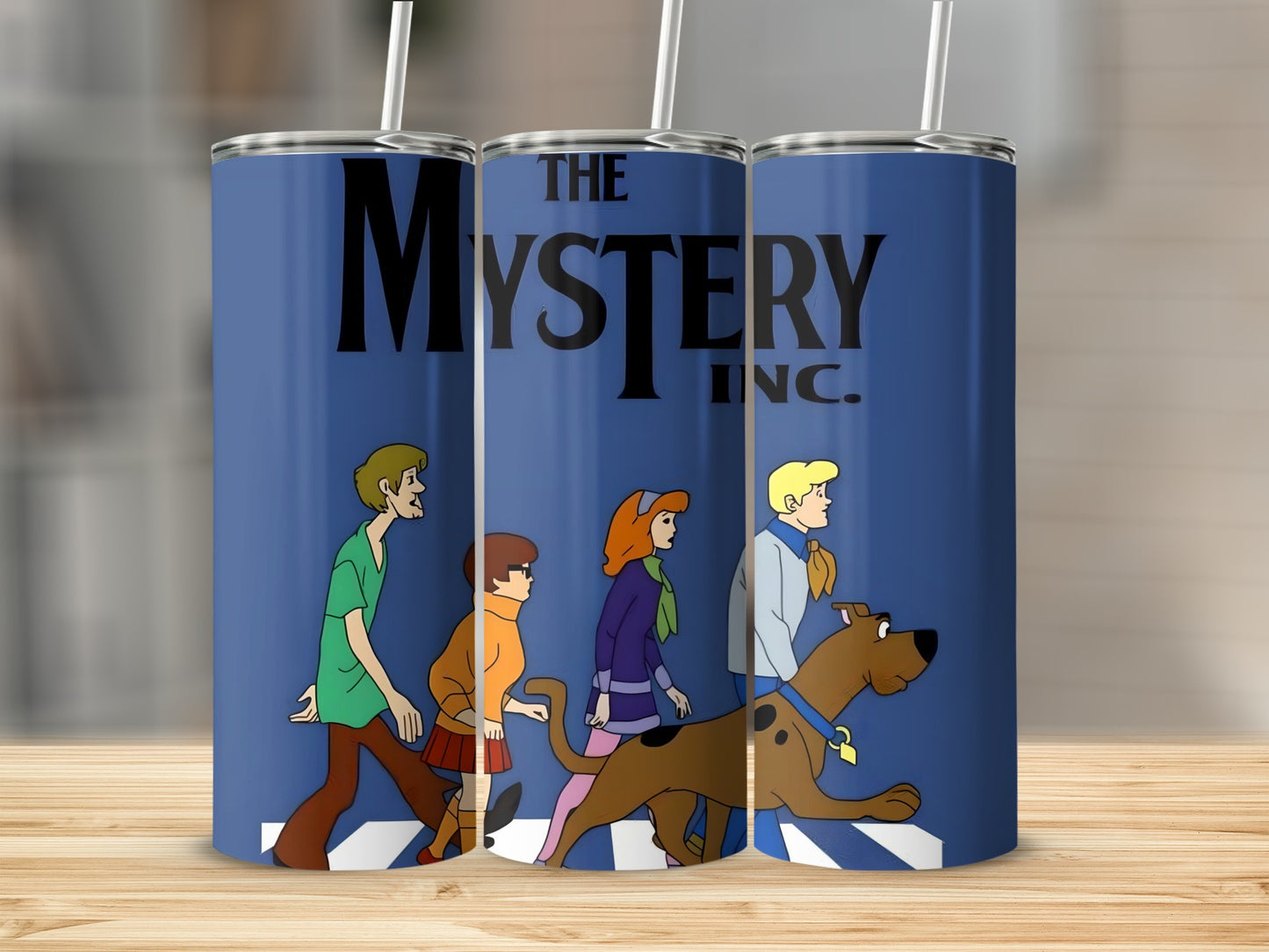 Scooby-Doo characters walking with "The Mystery Inc." logo on blue tumblers.