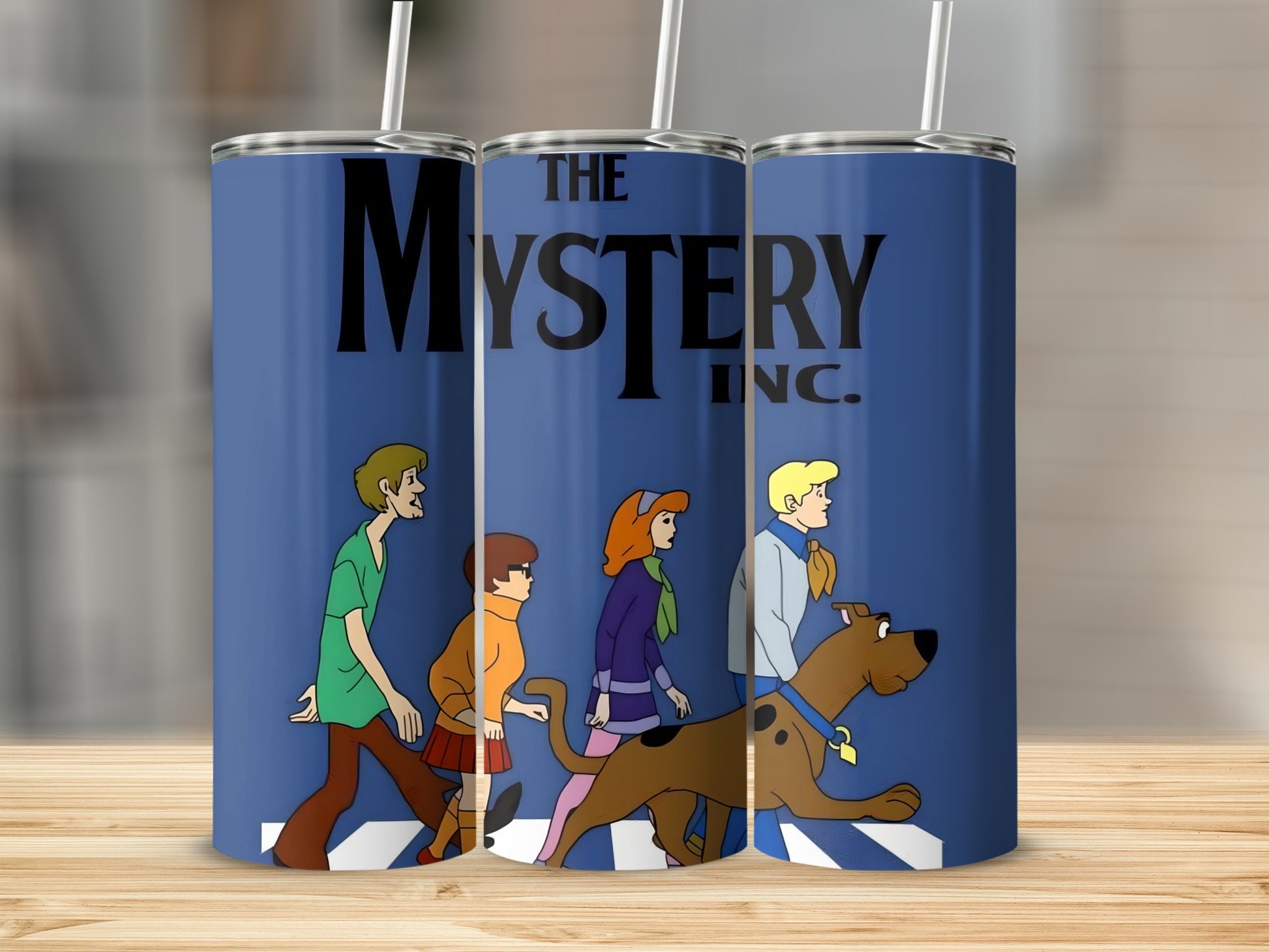 Scooby-Doo characters walking with "The Mystery Inc." logo on blue tumblers.