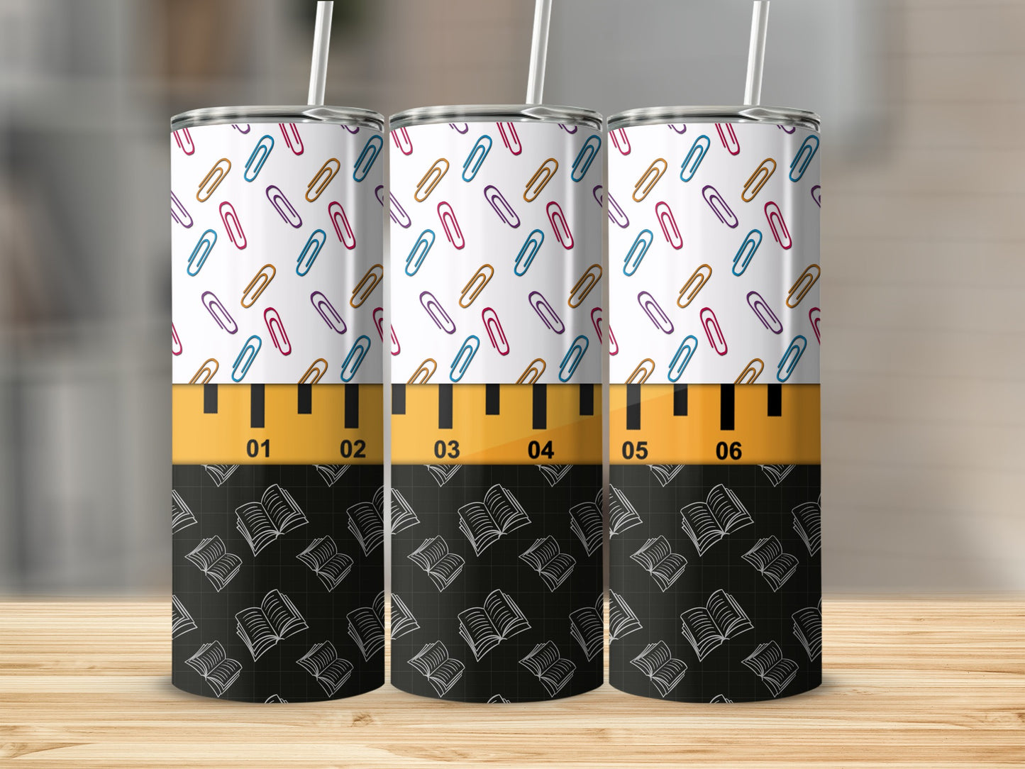 Tumbler with colorful paper clips and open books pattern.