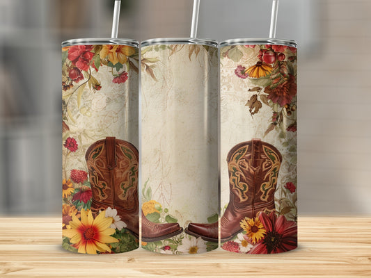 Brown cowboy boots with floral design on textured background.