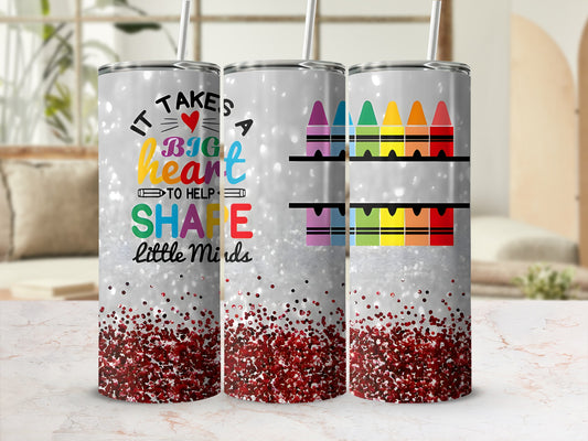 Glitter tumbler with "It Takes A Big Heart To Help Little Minds" and colorful crayons.