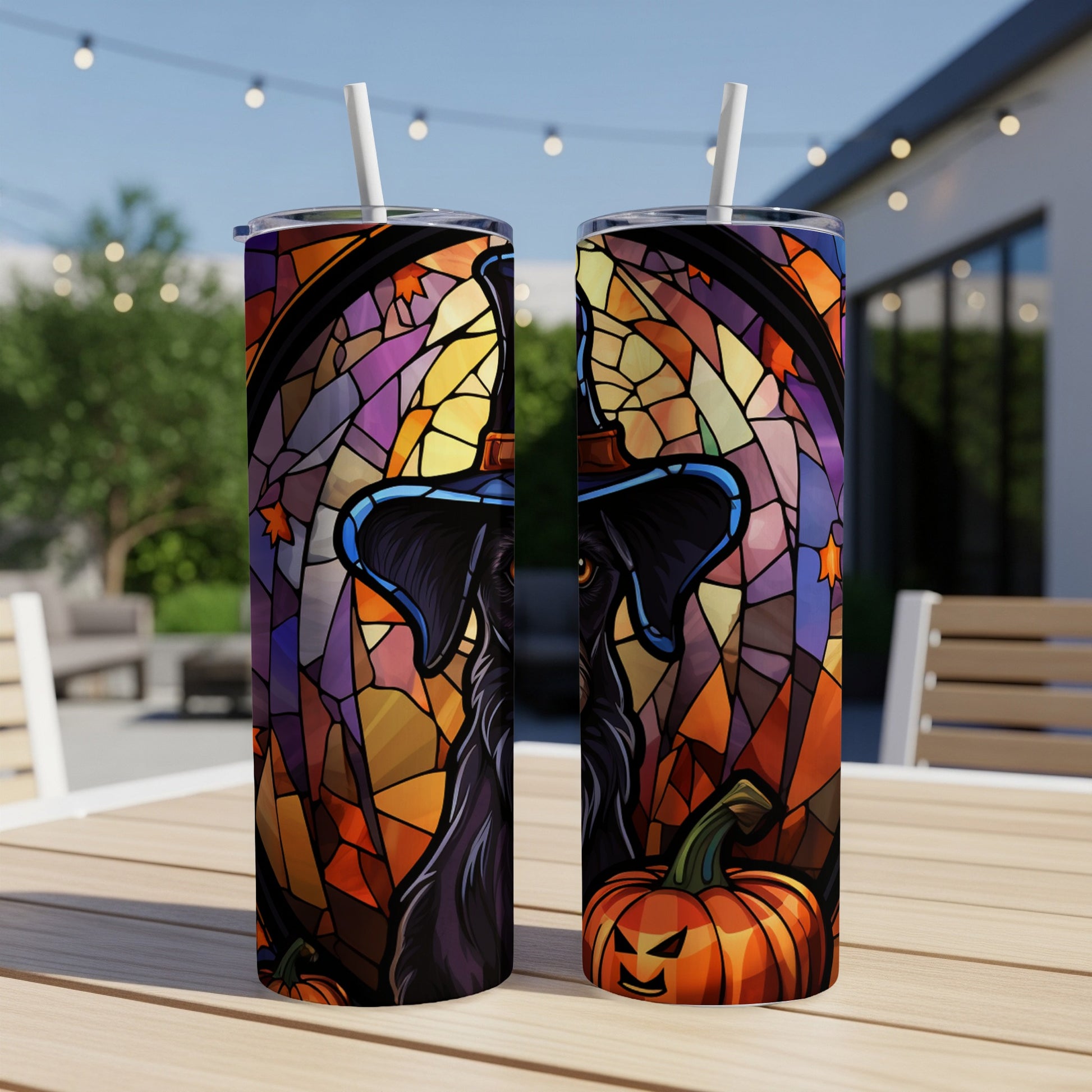 Black dog in witch hat with stained glass and pumpkins on tumbler.