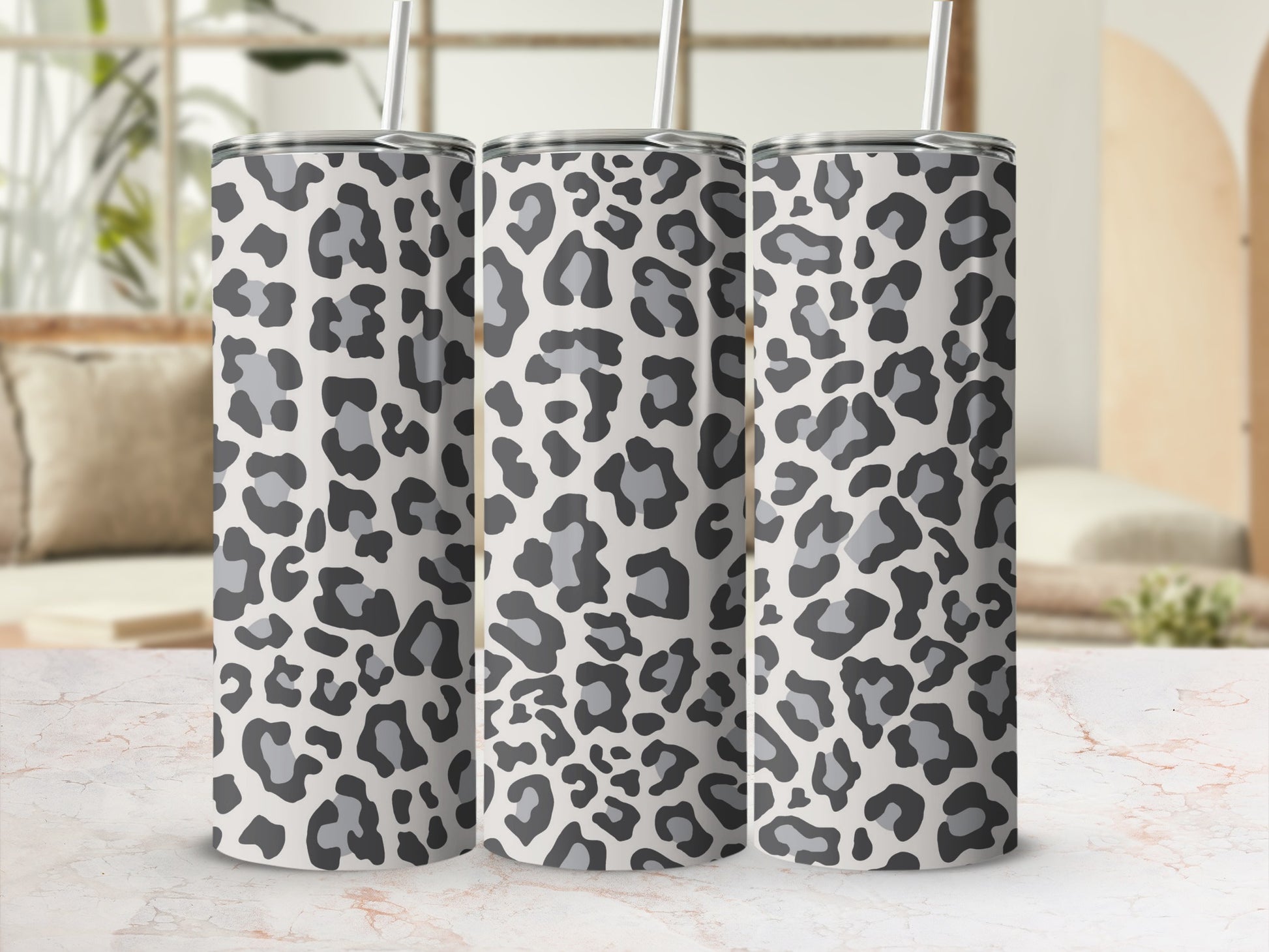 Three tumblers with a grey and black leopard print pattern.