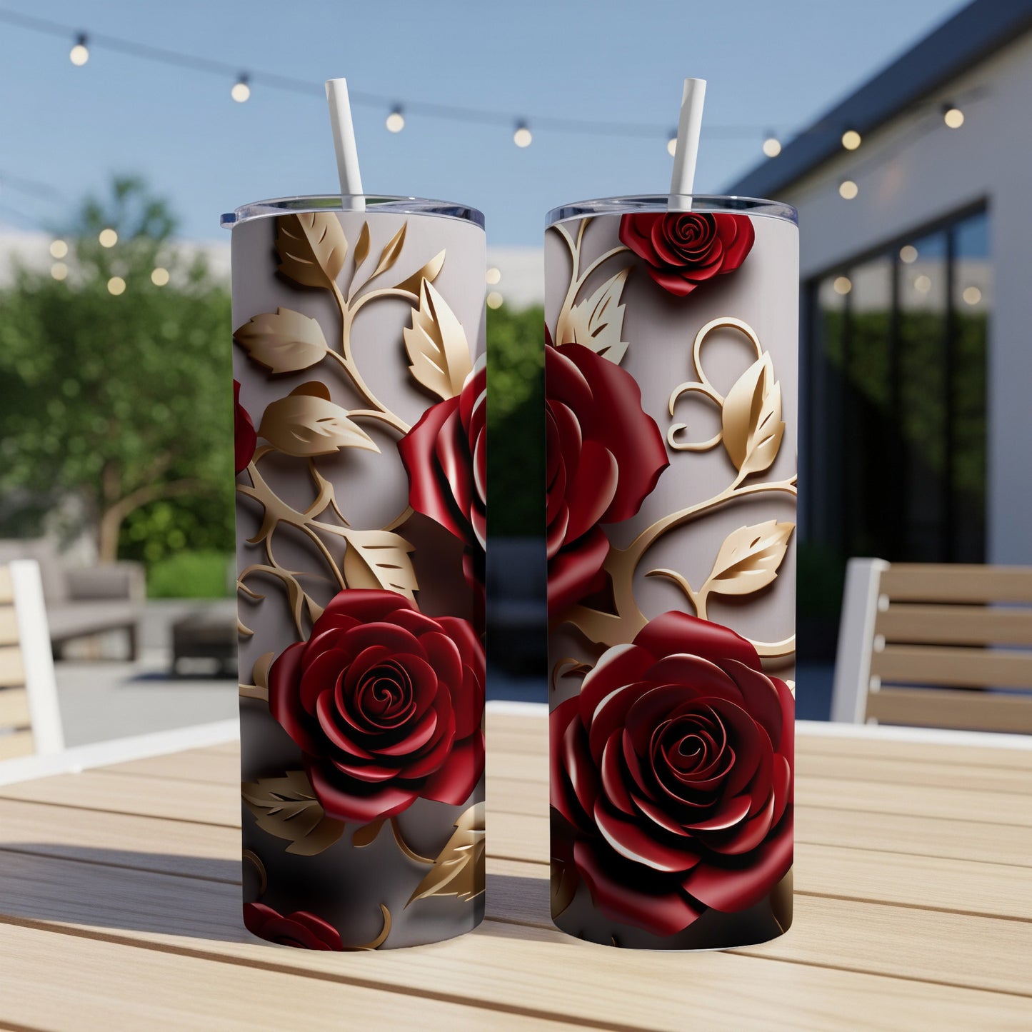 Two tall tumblers with red roses and gold vine accents.