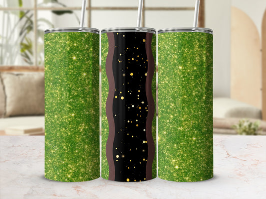 Three glitter-covered tumblers with straw, two green, one black and gold.