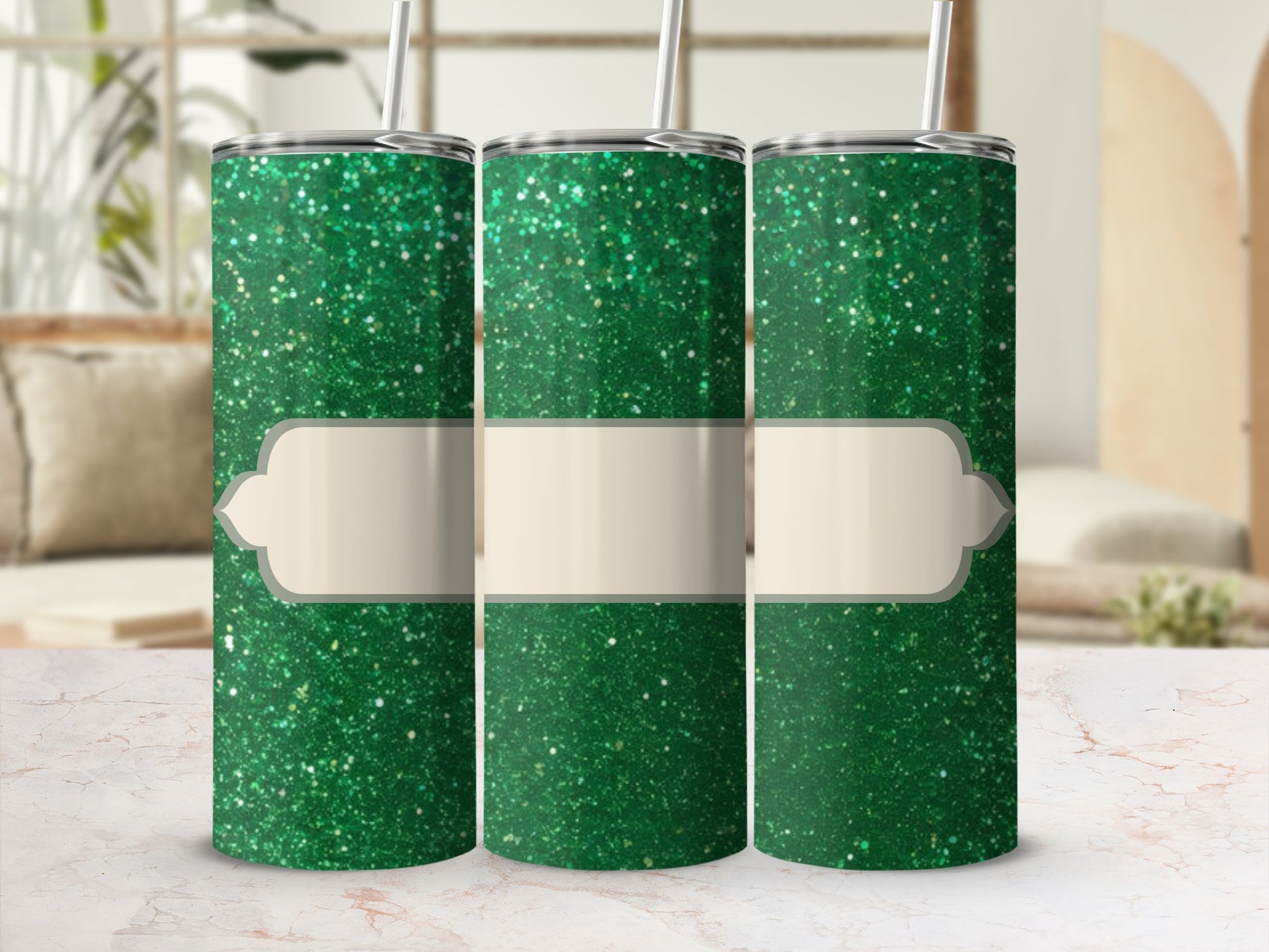 Three green glitter tumblers with blank cream-colored labels.