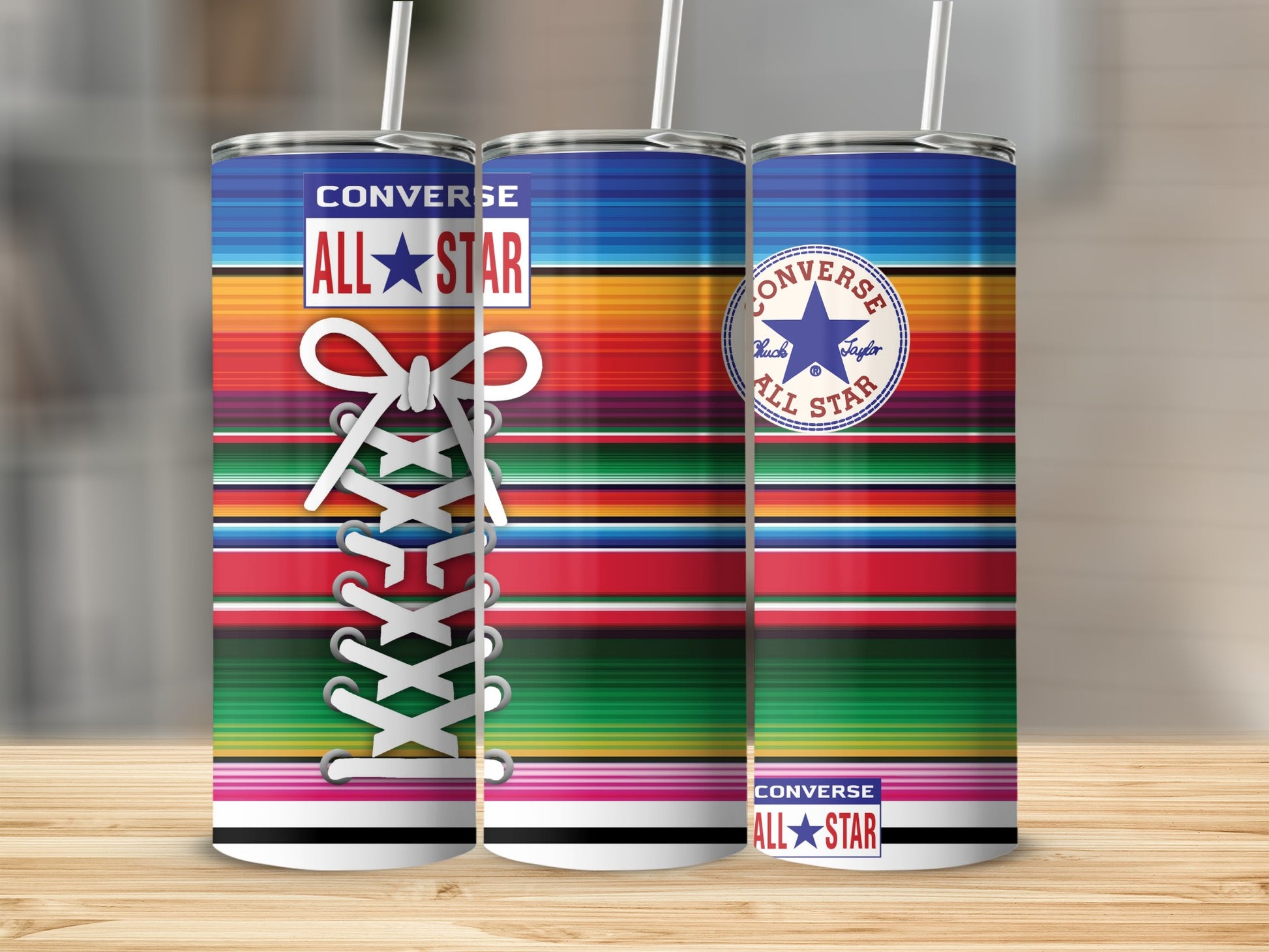 Converse All-Star tumblers with colorful striped pattern and white laces.