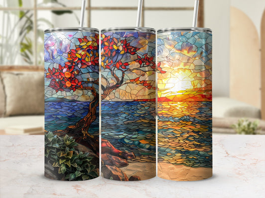 Three stained glass tumblers depicting a tree, ocean, and sunset.