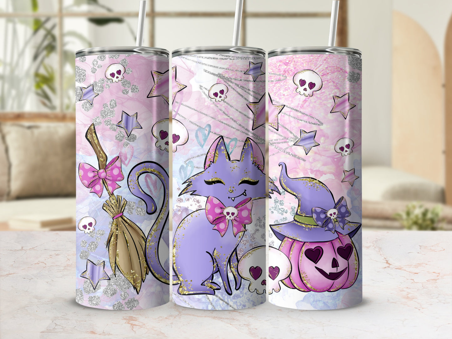 Three Halloween-themed tumblers: witch hat pumpkin, purple cat, and broomstick with glitter.