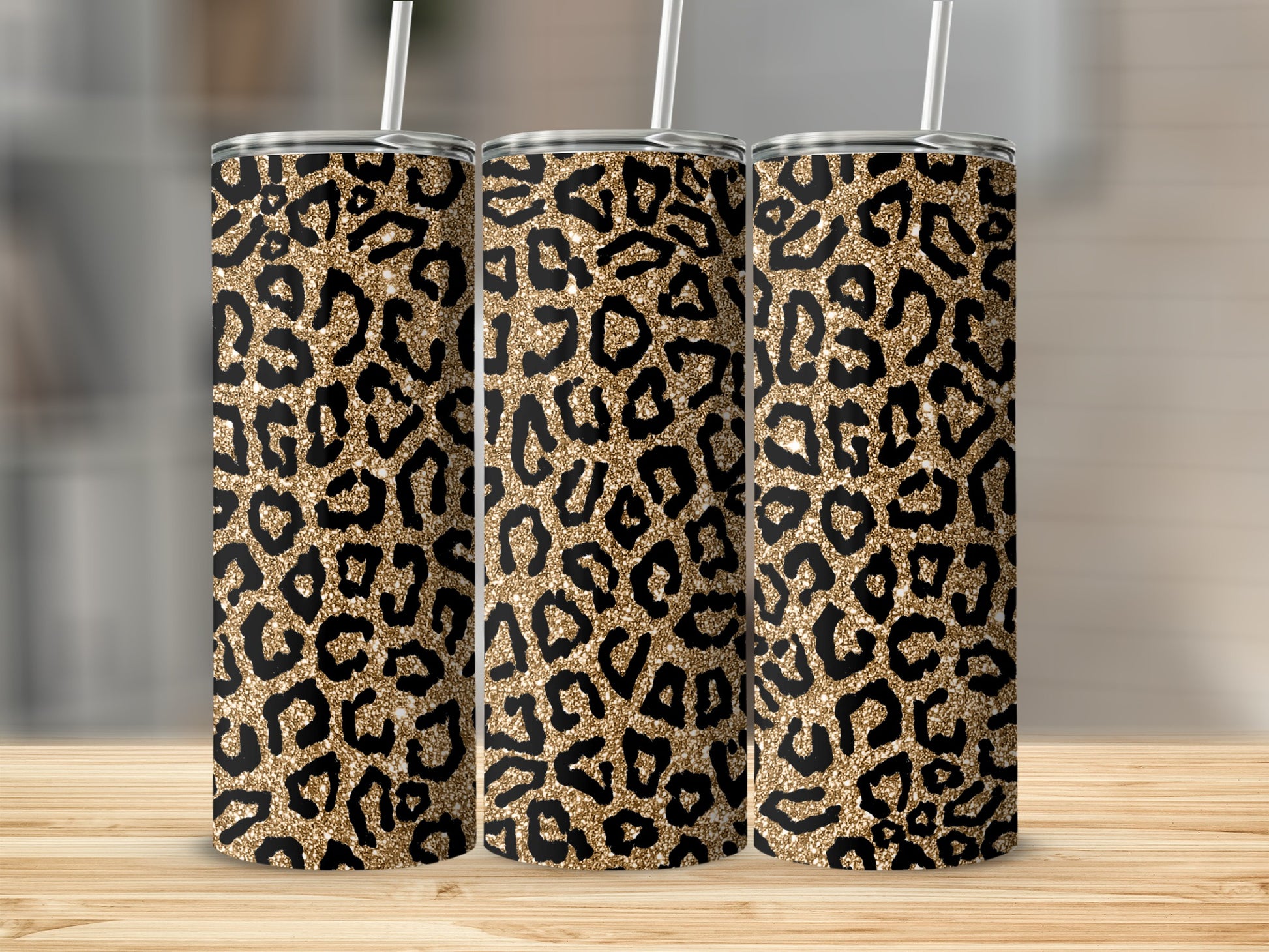 Three tumblers with a gold and black leopard print pattern.