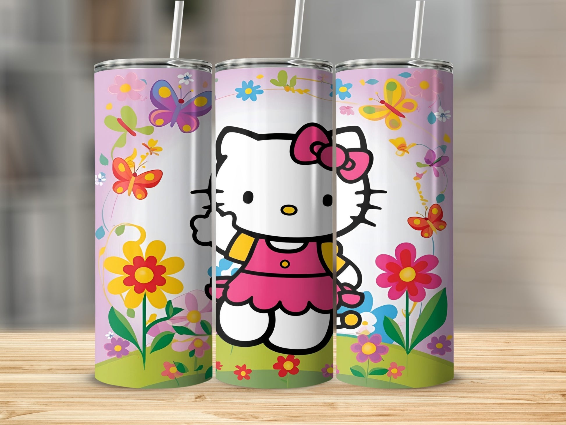 Hello Kitty with butterflies and flowers on pink tumbler.