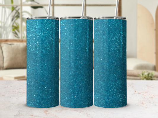 Three teal glitter tumblers with straws, displayed on a marble countertop.