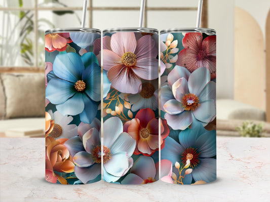 Three floral patterned tumblers with straws, featuring blue, pink, and coral flowers.