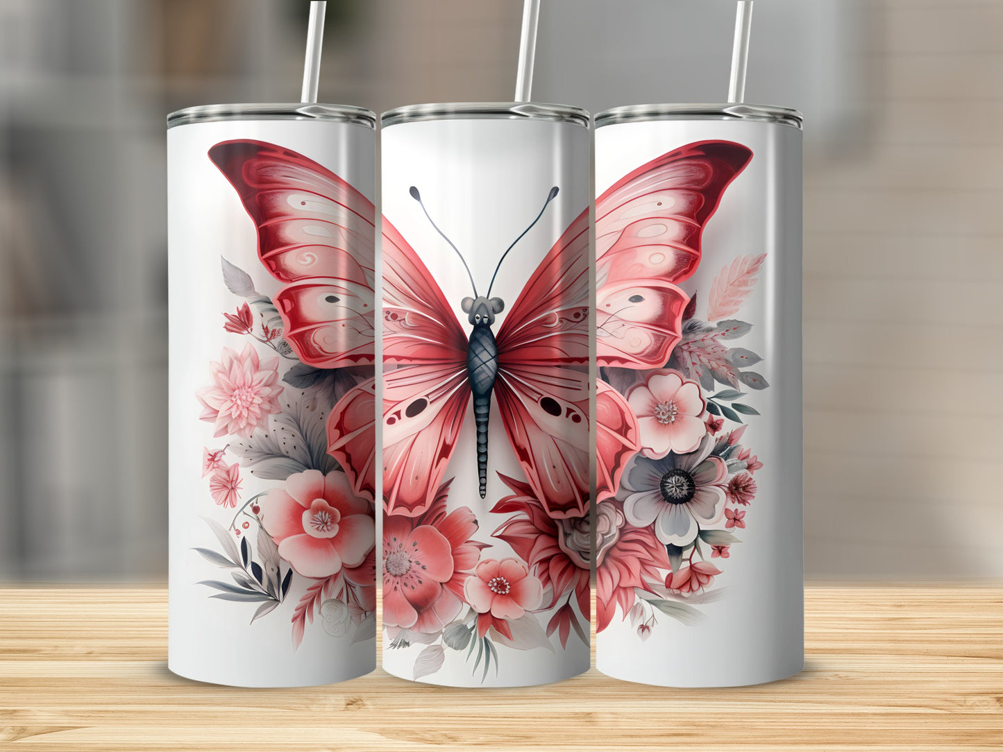 Three white tumblers with pink butterfly and floral designs.