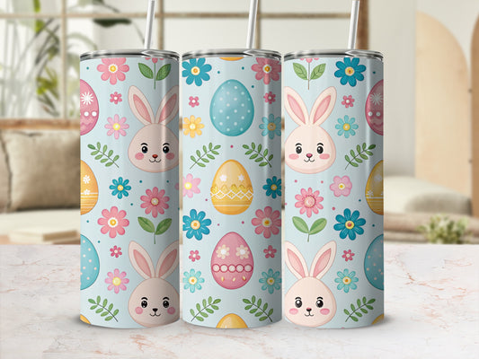 Three Easter-themed tumblers with smiling bunnies and floral patterns.