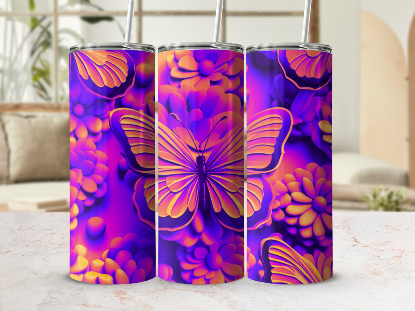 Purple and orange butterfly and floral pattern on three tumblers.