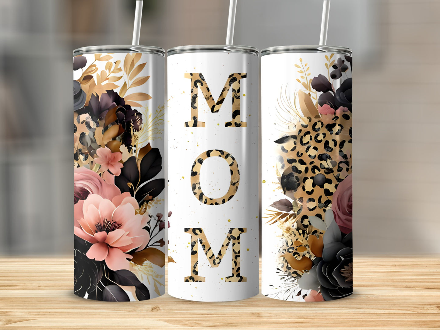 White tumbler with "MOM" in gold letters, surrounded by floral and leopard print.