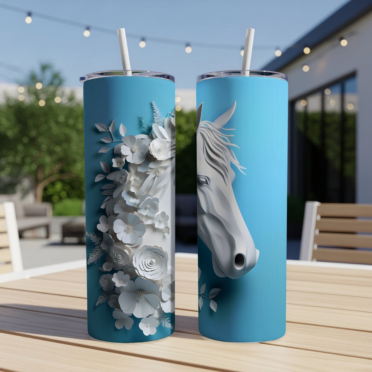 Two blue tumblers with a white horse head and floral design.