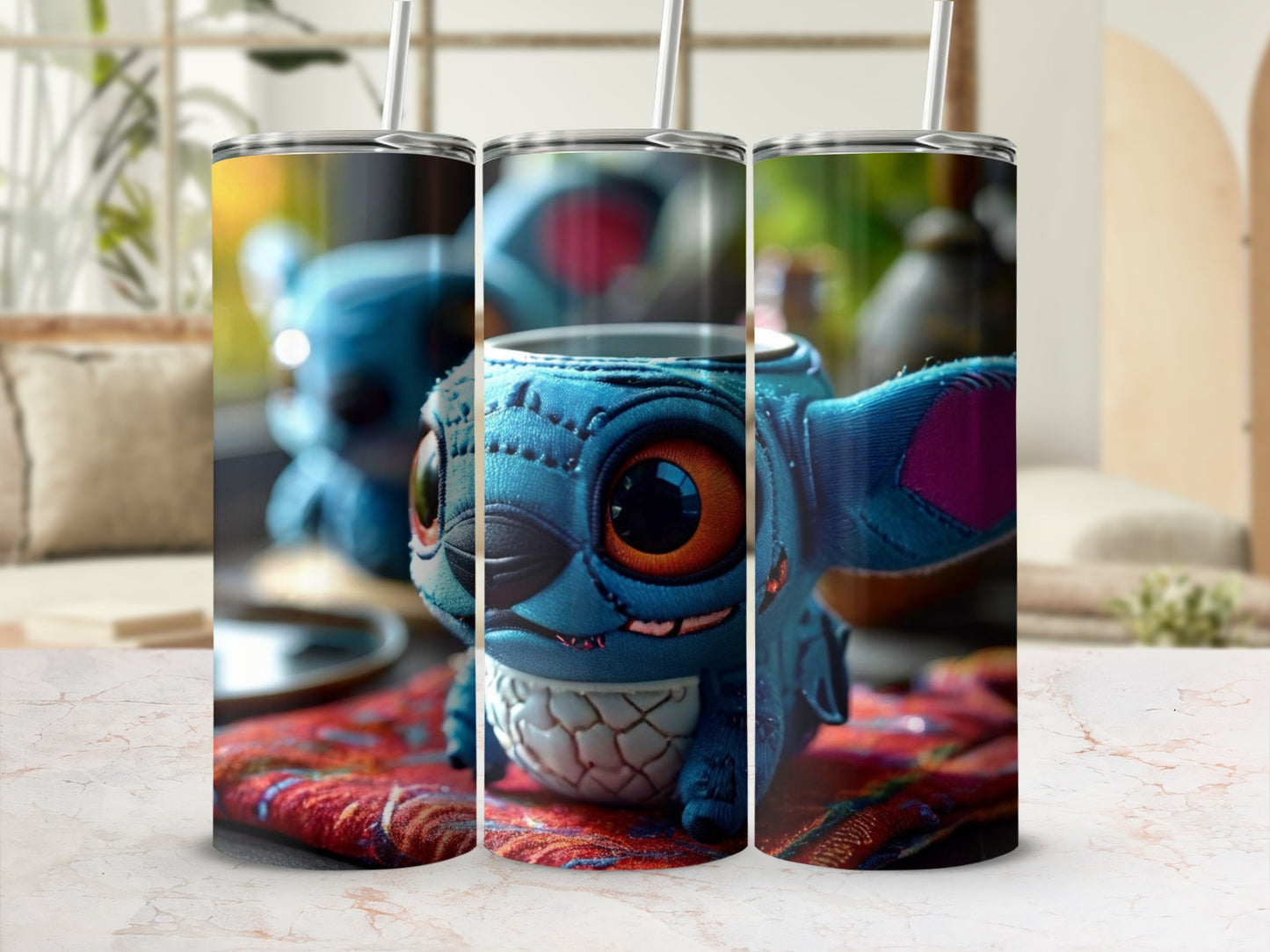 Three tumblers featuring a blue, stitched cartoon character with large ears and eyes.