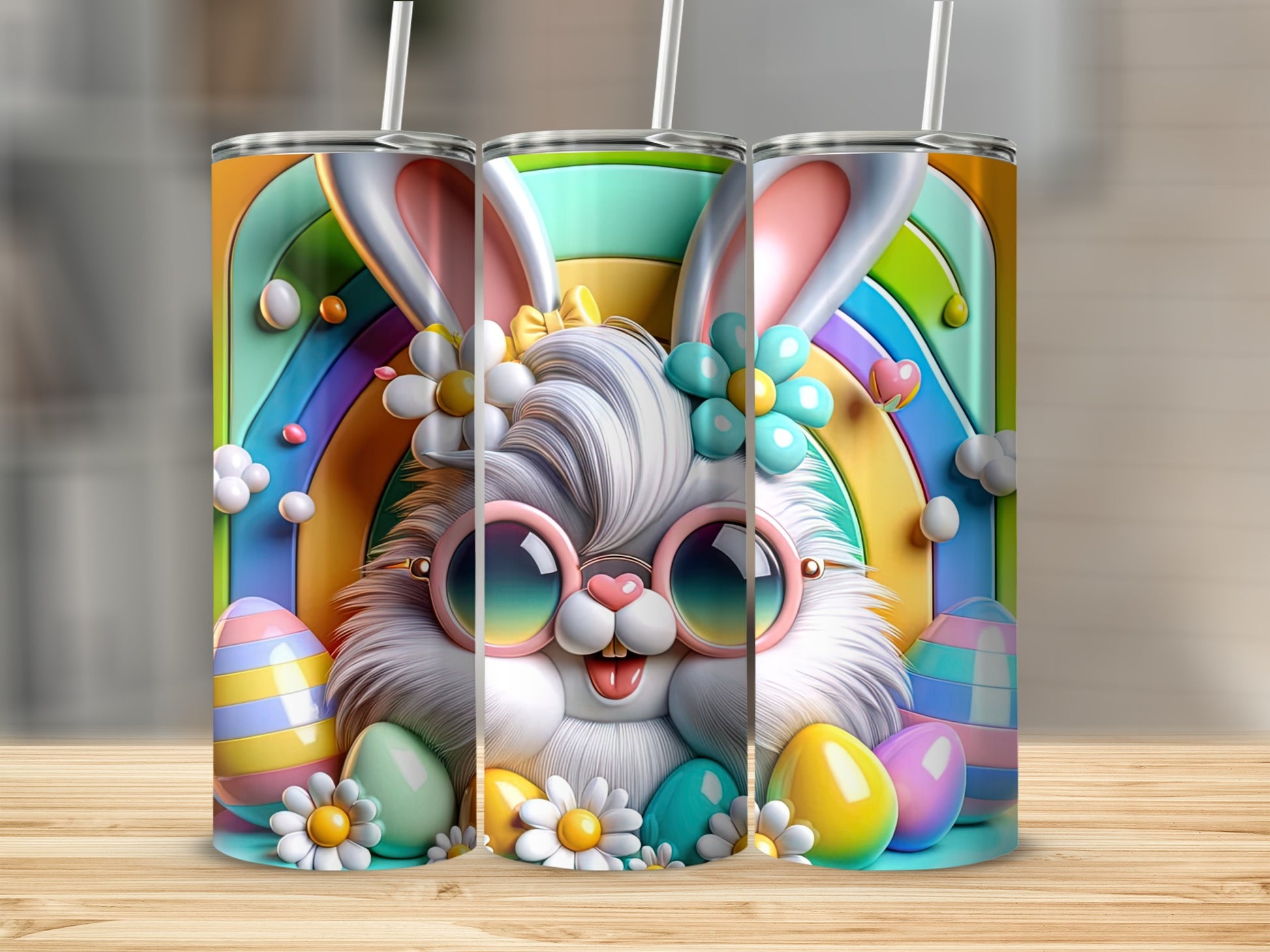 Fuzzy bunny with sunglasses and rainbow background on three tumblers.