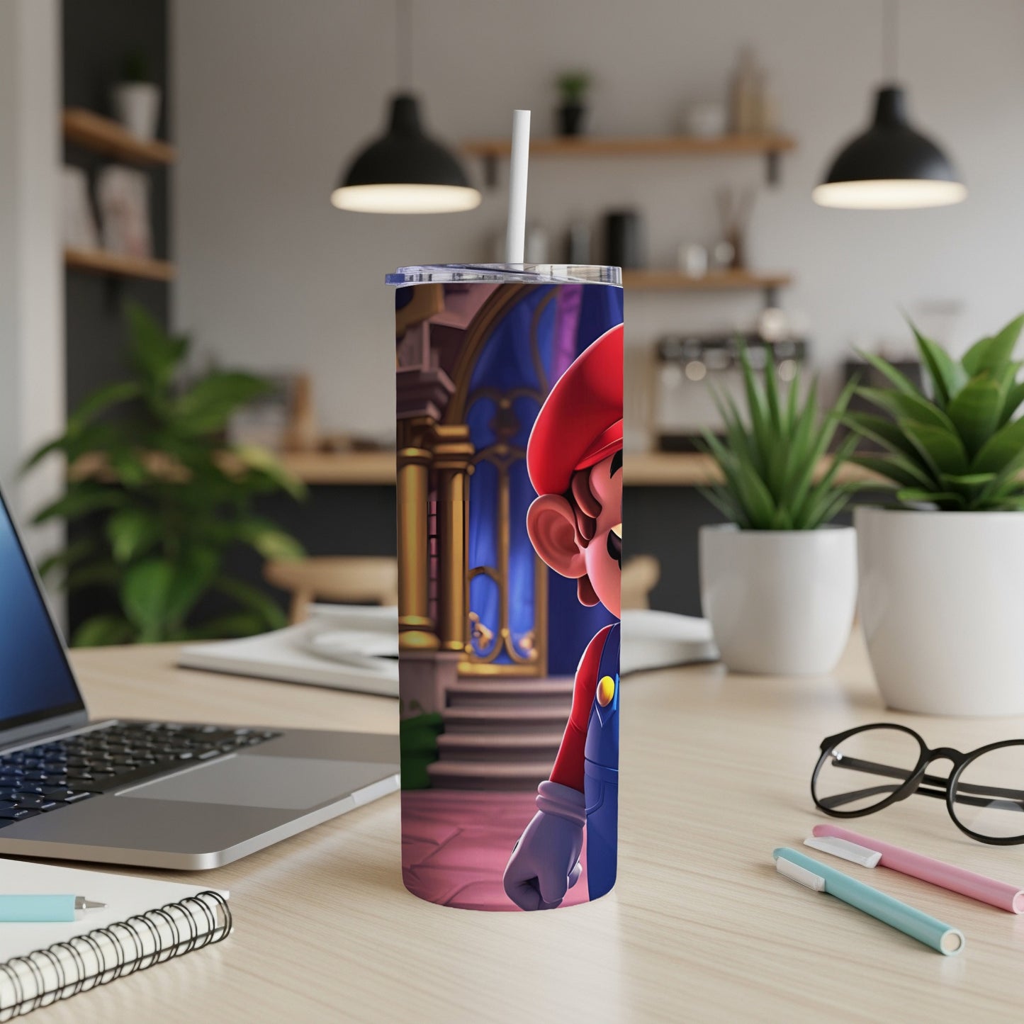 Mario character illustration on a white tumbler with a straw, on a desk.
