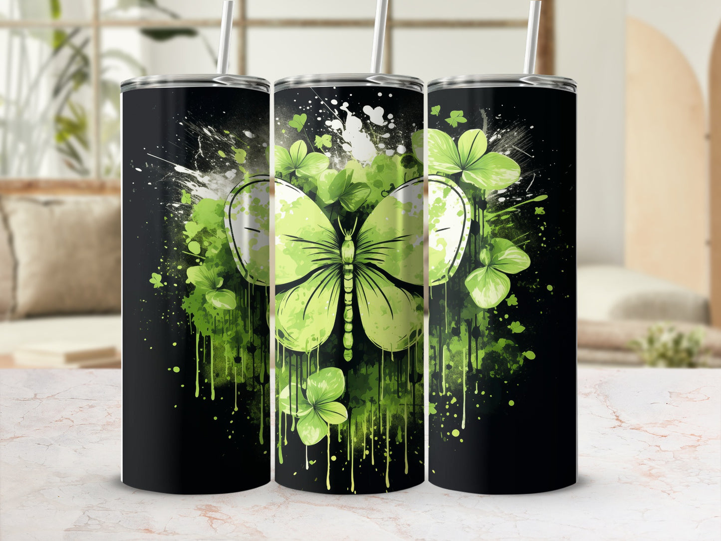 Black tumbler with green butterfly and shamrock design.