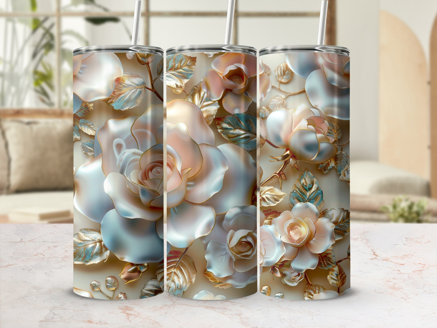 Three iridescent rose tumblers with gold leaf accents, displayed on a marble surface.
