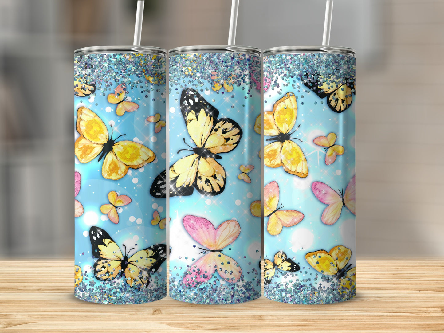 Blue glitter tumbler with colorful butterflies and sparkles.