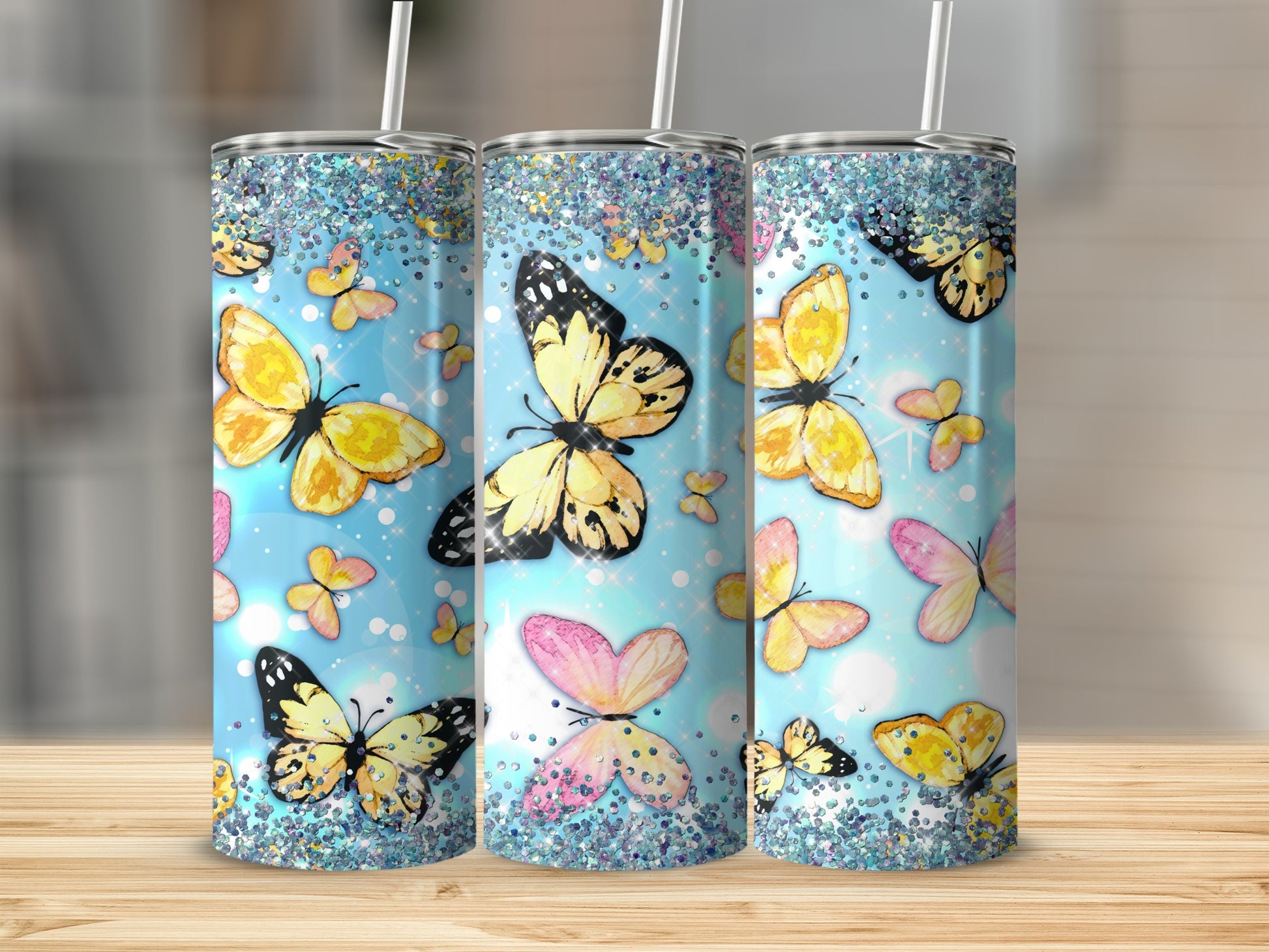Blue glitter tumbler with colorful butterflies and sparkles.